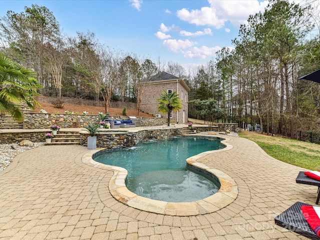 view of swimming pool with a fenced in pool, a patio area, and fence