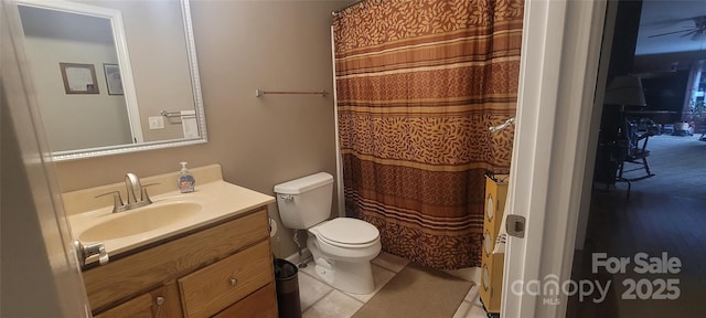 bathroom with vanity, toilet, and tile patterned flooring