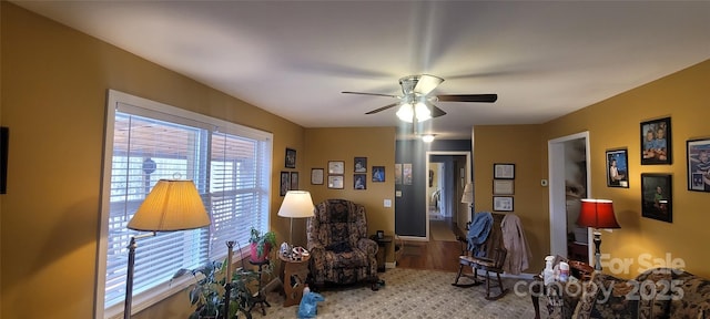 sitting room with ceiling fan