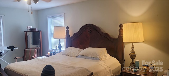 bedroom with multiple windows and ceiling fan