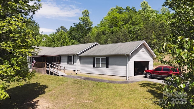 25 Upland Rd, Brevard, NC 28712 - view of front of home with a front yard, driveway, and an attached garage