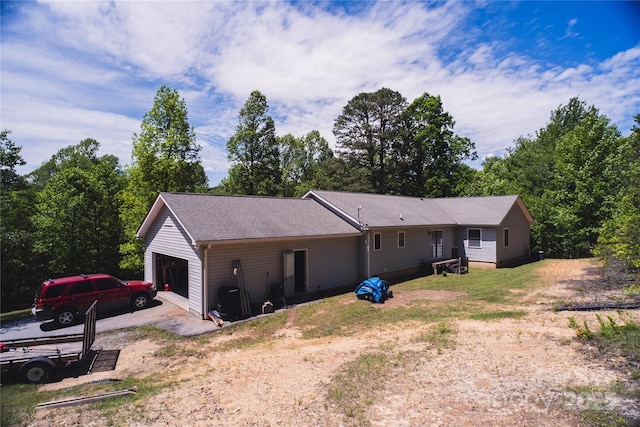 25 Upland Rd, Brevard, NC 28712 - view of property exterior featuring dirt driveway and a garage