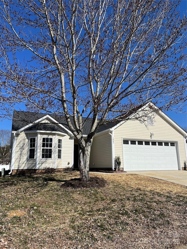 ranch-style house featuring a garage