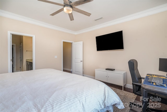 bedroom featuring dark wood-type flooring, ceiling fan, ornamental molding, and ensuite bathroom