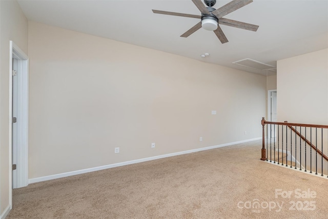 empty room featuring ceiling fan and light carpet