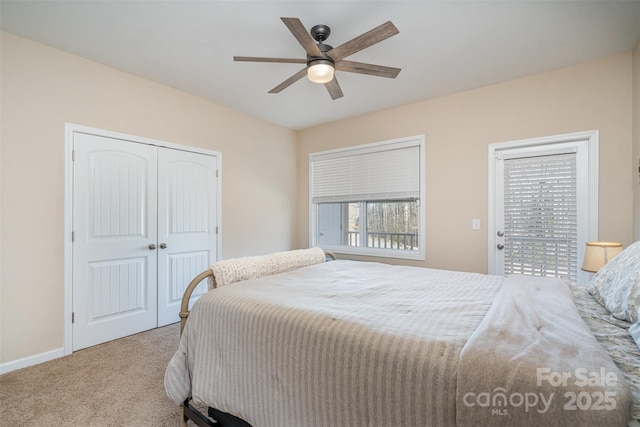 bedroom with light colored carpet, access to exterior, ceiling fan, and a closet