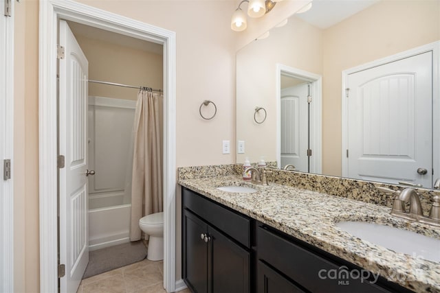 full bathroom featuring shower / bath combination with curtain, vanity, toilet, and tile patterned flooring