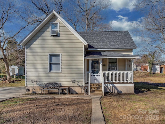 bungalow featuring cooling unit and covered porch