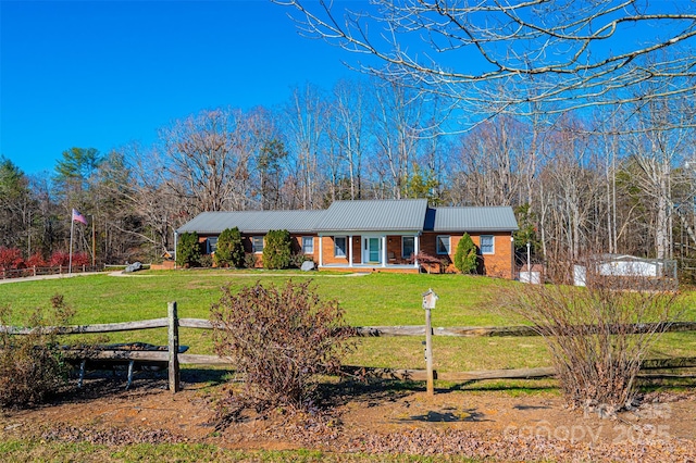 single story home featuring a front yard