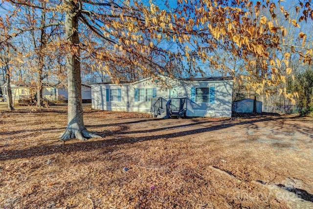 exterior space featuring a storage shed