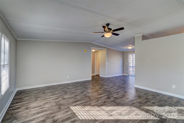 empty room featuring lofted ceiling, dark wood-type flooring, and ceiling fan