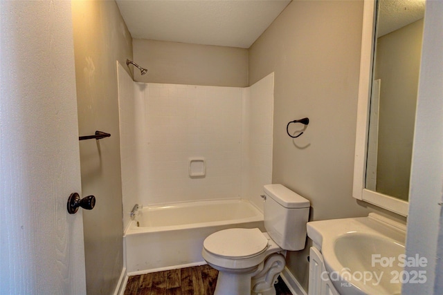 full bathroom featuring shower / bath combination, wood-type flooring, vanity, and toilet