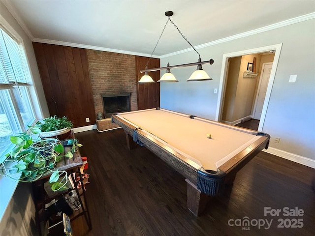 playroom with billiards, ornamental molding, dark hardwood / wood-style floors, and a fireplace