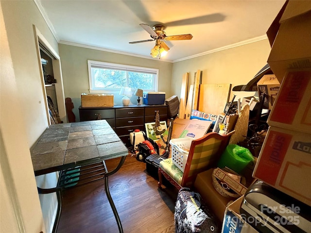 interior space with dark wood-type flooring, ceiling fan, and ornamental molding