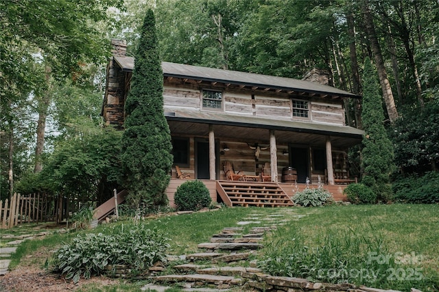 view of outbuilding featuring covered porch