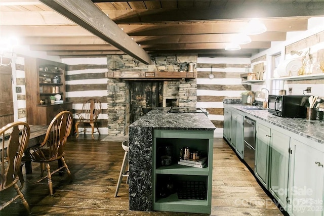 bar featuring hardwood / wood-style flooring, sink, beam ceiling, and dark stone counters