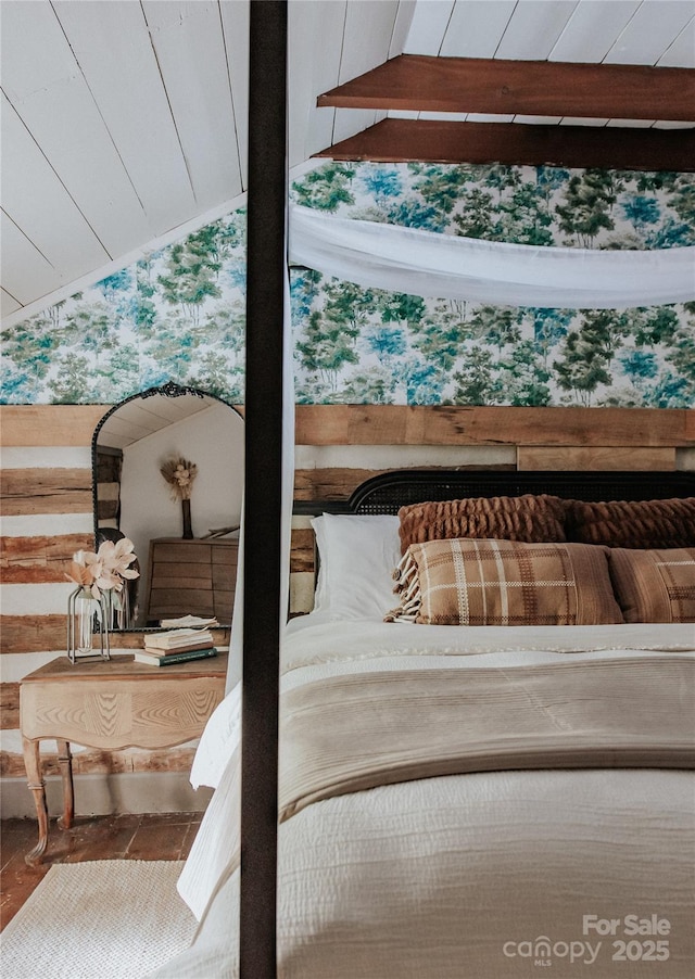 bedroom with wood walls