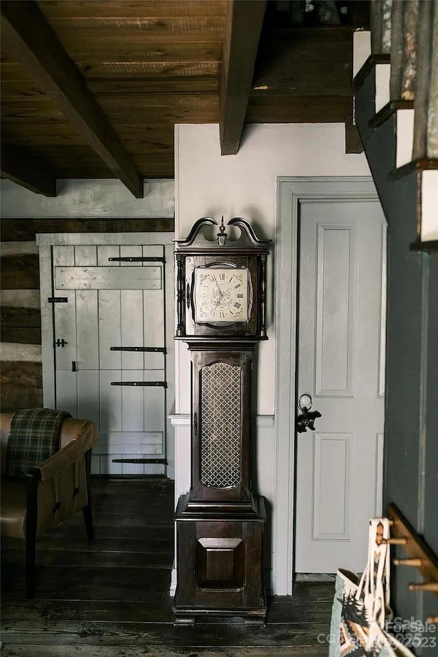 mudroom featuring beamed ceiling, dark wood-type flooring, and wooden ceiling