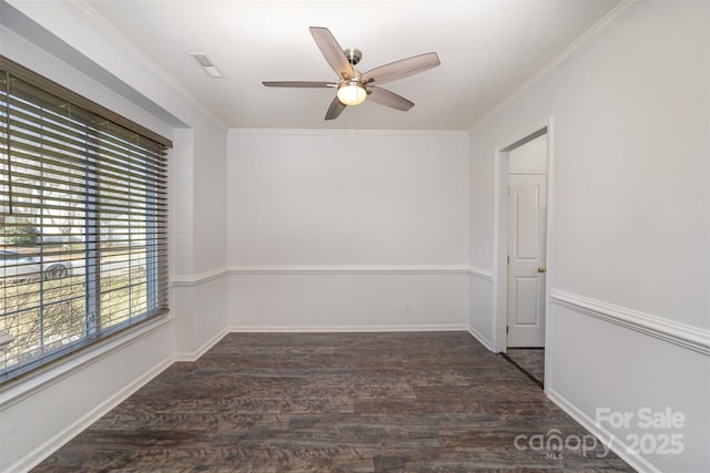 unfurnished room featuring dark wood-type flooring, ornamental molding, and ceiling fan