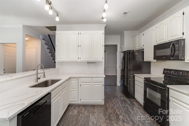 kitchen with sink, dark wood-type flooring, black appliances, and white cabinets