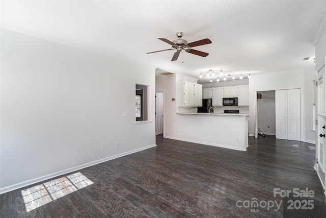 unfurnished living room featuring dark wood-type flooring, ceiling fan, and ornamental molding