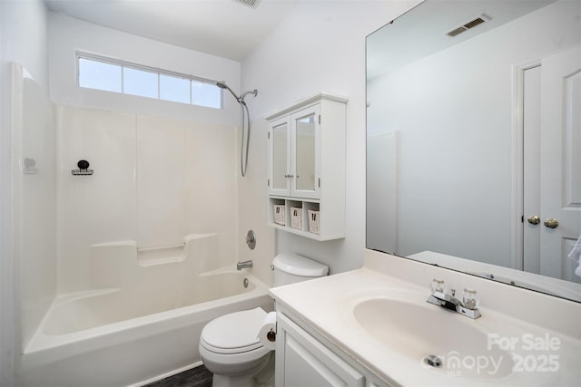 full bathroom with shower / tub combination, vanity, and toilet