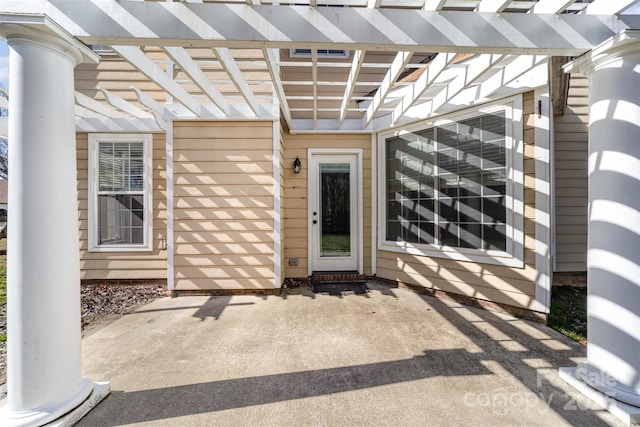 property entrance featuring a patio area