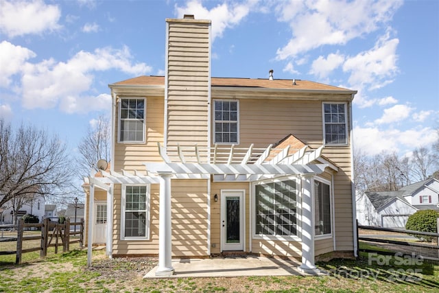 back of house featuring a patio and a pergola