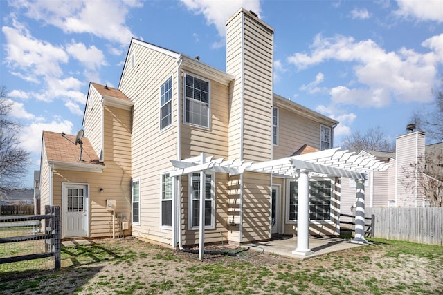 back of house featuring a patio area and a pergola