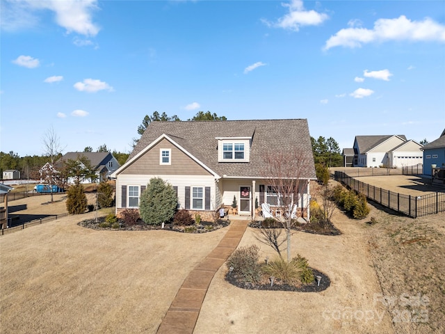 view of front of property featuring a porch and a front lawn