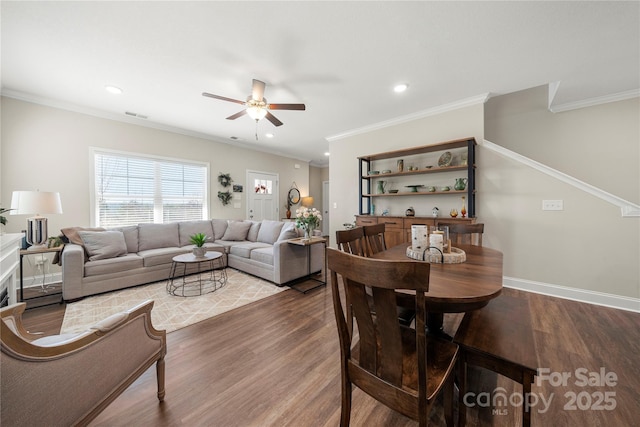 living room with crown molding and hardwood / wood-style flooring