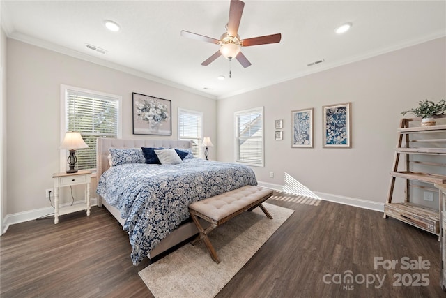 bedroom with multiple windows, crown molding, and dark hardwood / wood-style floors