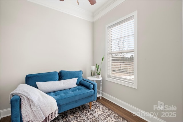 living area with crown molding, hardwood / wood-style floors, and ceiling fan