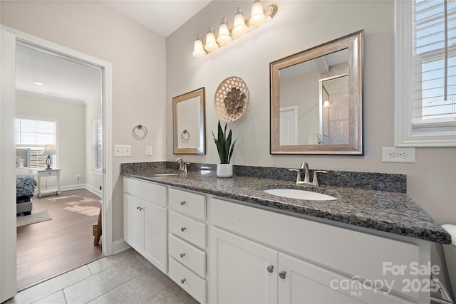 bathroom featuring vanity and tile patterned flooring