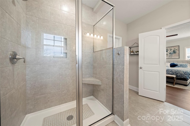 bathroom featuring a shower with shower door