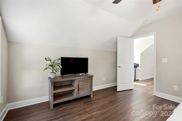 interior space featuring ceiling fan, lofted ceiling, and dark hardwood / wood-style floors