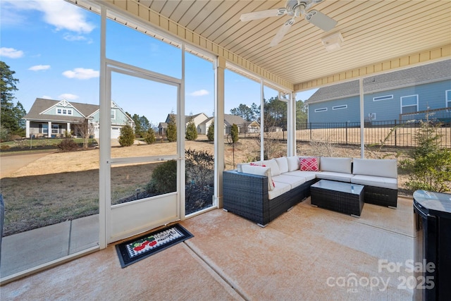 sunroom featuring ceiling fan