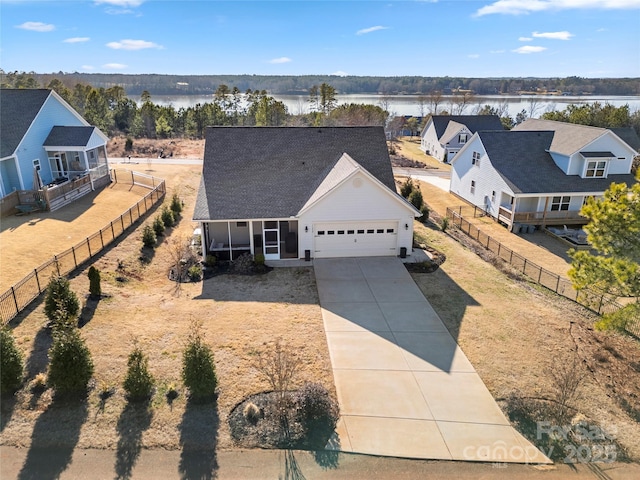 view of front of home featuring a garage and a water view