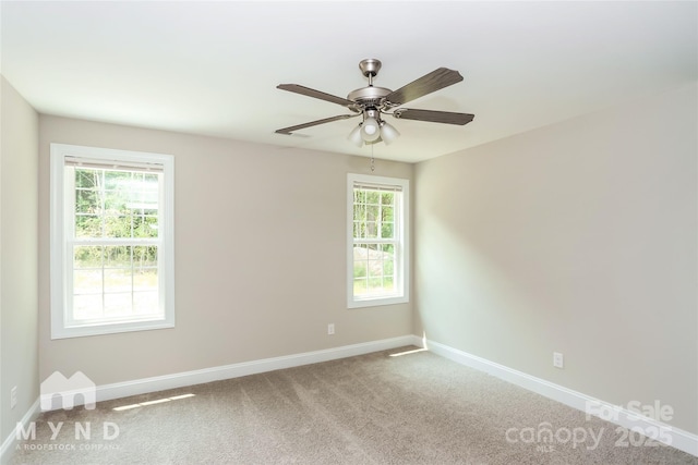 carpeted empty room with ceiling fan