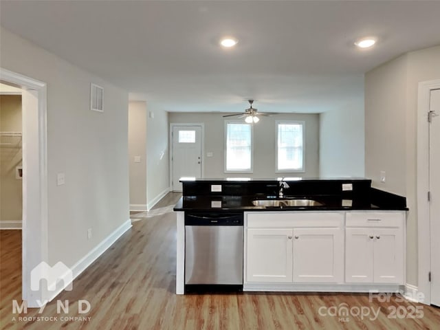 kitchen featuring sink, ceiling fan, white cabinetry, light hardwood / wood-style floors, and stainless steel dishwasher