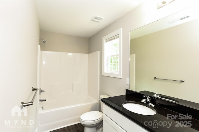 full bathroom with shower / bathtub combination, vanity, toilet, and wood-type flooring