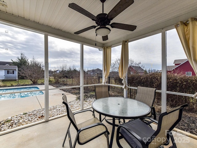 sunroom with plenty of natural light and ceiling fan