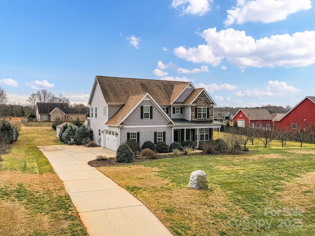 view of front of home featuring a garage and a front yard