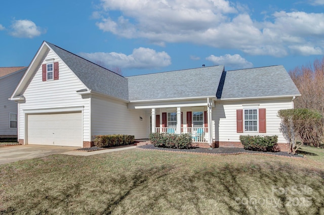 view of front of home with a porch, a garage, and a front yard