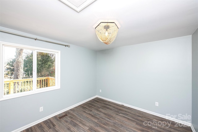 unfurnished room featuring dark hardwood / wood-style floors