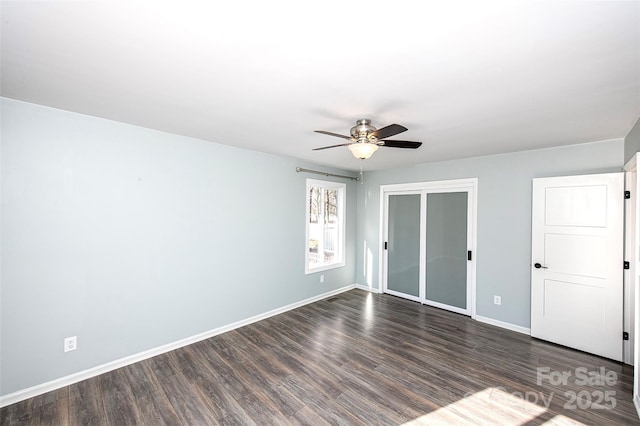 unfurnished bedroom with dark wood-type flooring, ceiling fan, and a closet