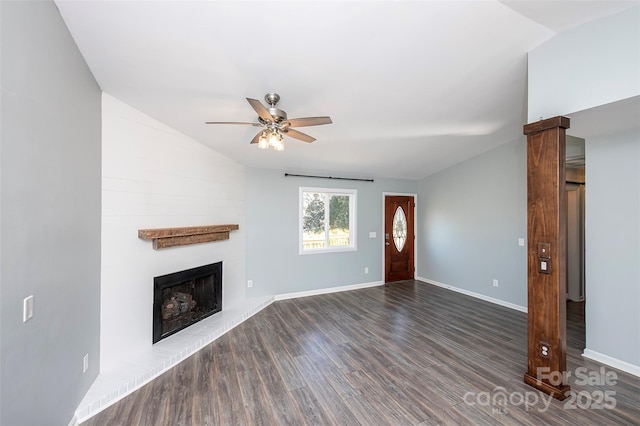 unfurnished living room with ceiling fan, vaulted ceiling, and dark hardwood / wood-style flooring