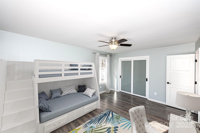 bedroom featuring dark wood-type flooring, a closet, and ceiling fan