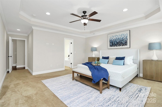 bedroom featuring recessed lighting, baseboards, a tray ceiling, and light colored carpet