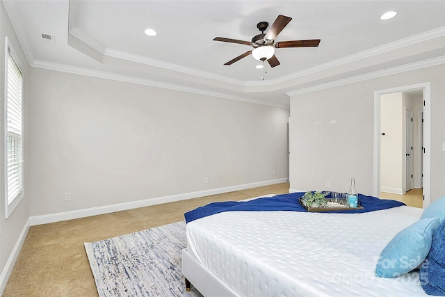 bedroom featuring multiple windows, baseboards, crown molding, and light colored carpet